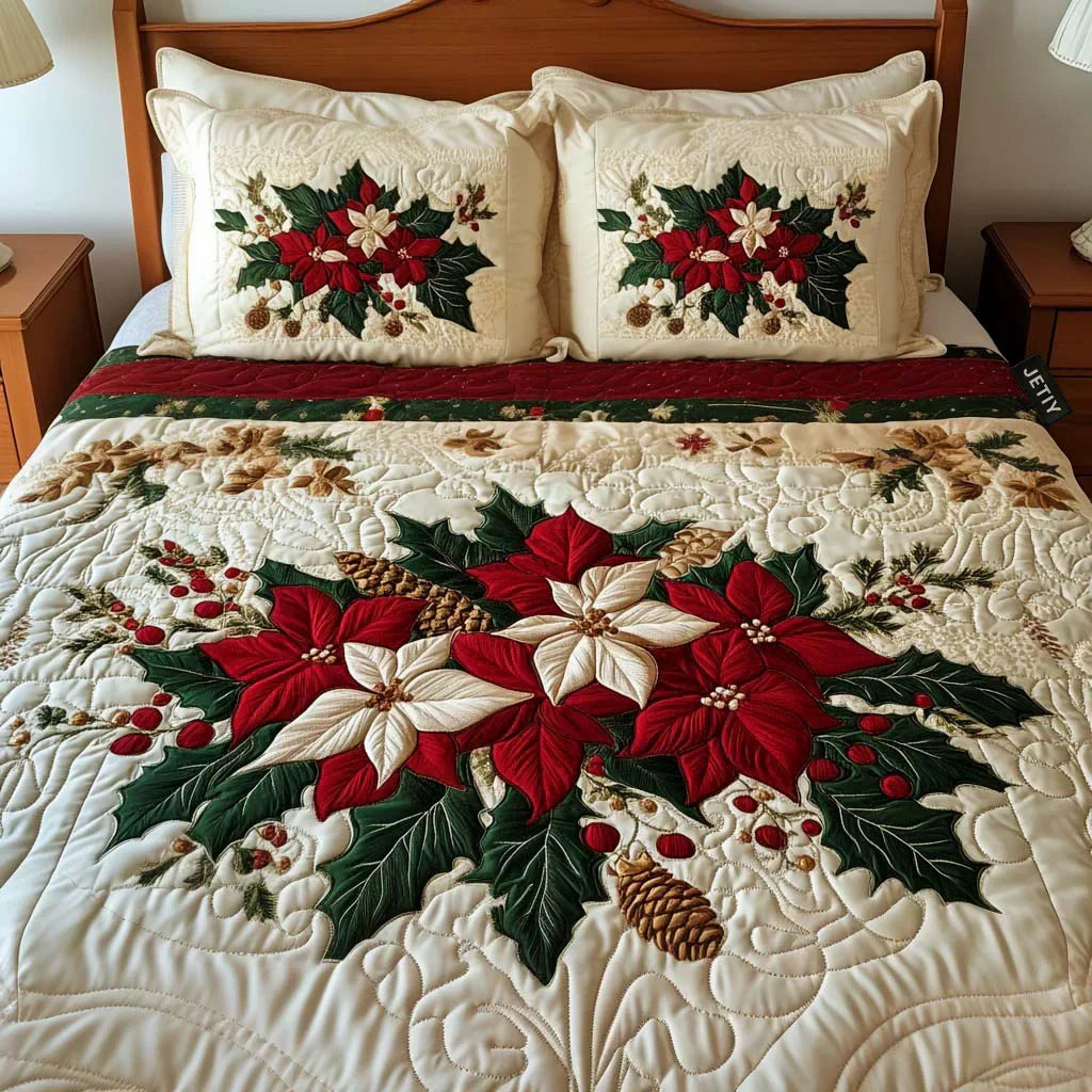 Quilted bedspread set with full red poinsettia blooms and dark green foliage on warm cream in the Poinsettia design