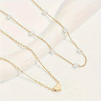 Gold-tone two-strand pearl and heart necklace with bracelet