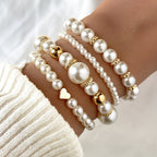 Four faux pearl stretch bracelets with gold-tone beads