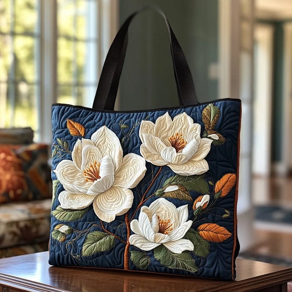 Artisan quilted tote bag with Delicate Magnolia blooms shading from cream to blush along a dark bare branch