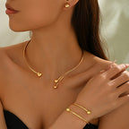 Gold-tone open collar necklace, bangle and studs set