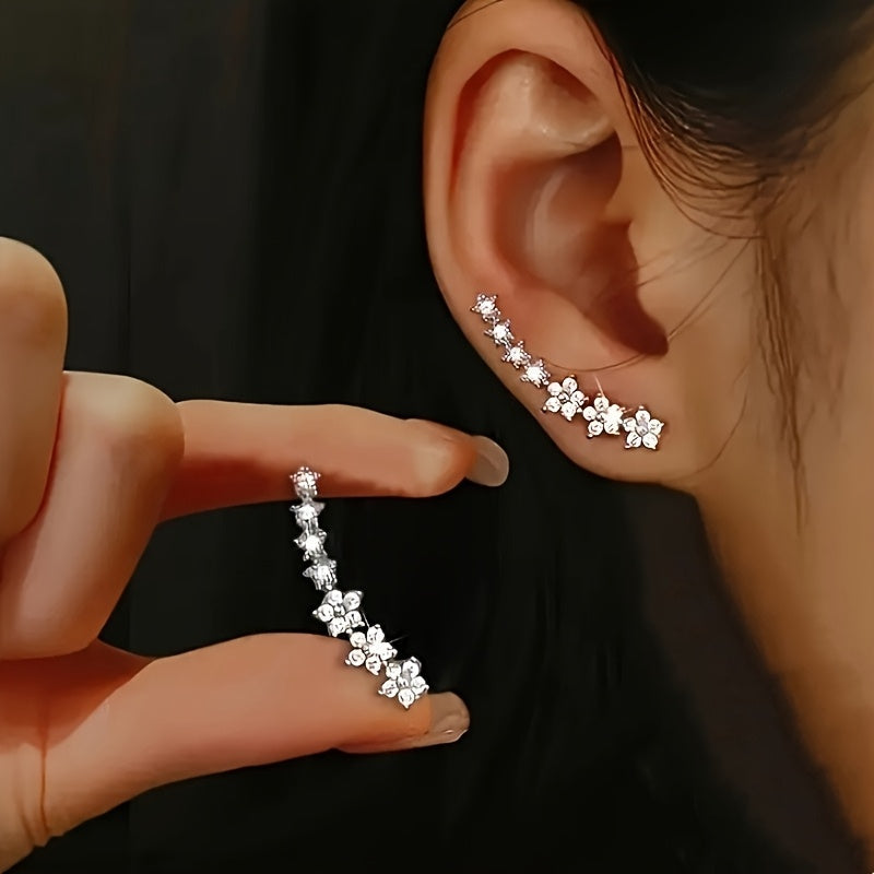 Crystal flower ear climber earrings worn on the ear