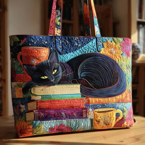 Artisan quilted tote bag with the Black Cat with Books and Mugs design, a black cat between a stack of books and two patterned mugs.