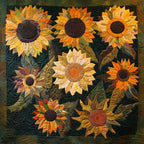 Amber Sunflowers quilted throw – golden sunflowers on deep green