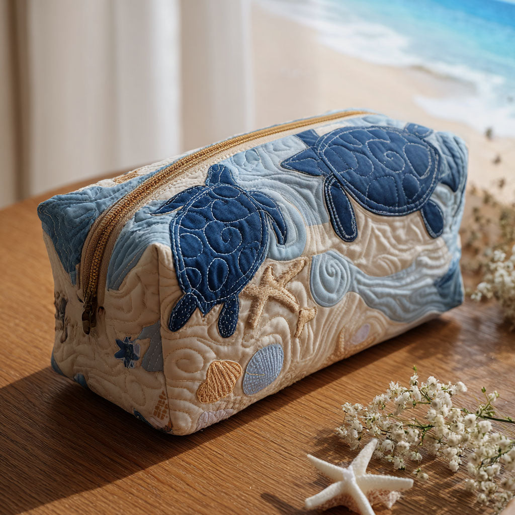 Aqua Shell quilted make-up bag with blue sea turtles swimming over cream quilting with shells