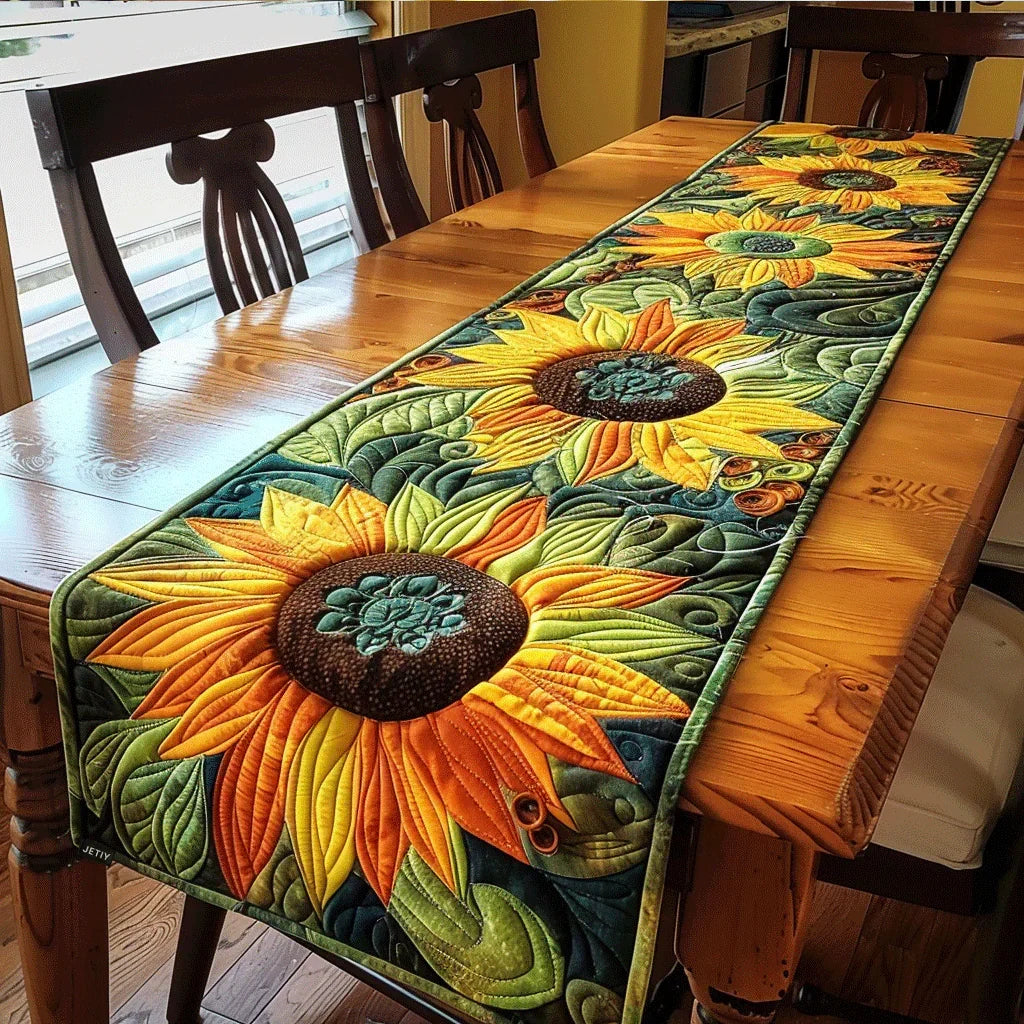 Quilted table runner with crowded gold sunflower heads against dark green leaves