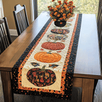 Pumpkin Parade Black quilted table runner – patterned pumpkins on cream