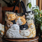 Artisan quilted tote bag with the Sleeping Kittens design, two kittens curled asleep together in soft grey and cream.