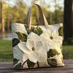 Artisan quilted tote bag with open white lilies on loose crossing stems against a soft ground