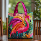 Artisan quilted tote bag with a rainbow flamingo in coral, turquoise and gold, its long neck curving across banded colour panels