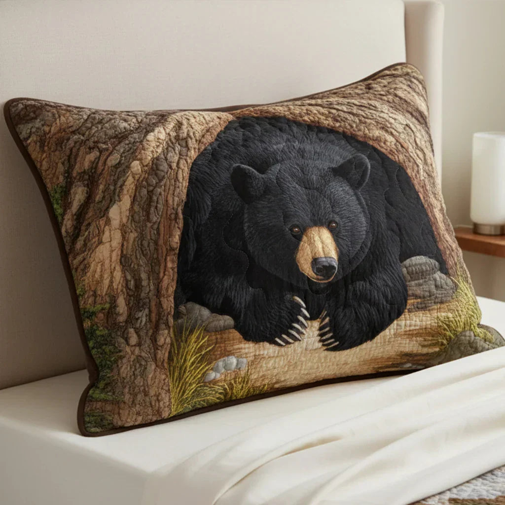 Quilted pillowcase with the Bear Retreat design, a bear among tall pine trees and rolling hills in warm woodland browns and greens, with wave-stitch quilting across the front
