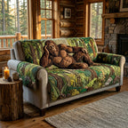 Bigfoot Alpine quilted sofa cover with a shaggy sasquatch across the seat on a dense green forest of ferns and pine