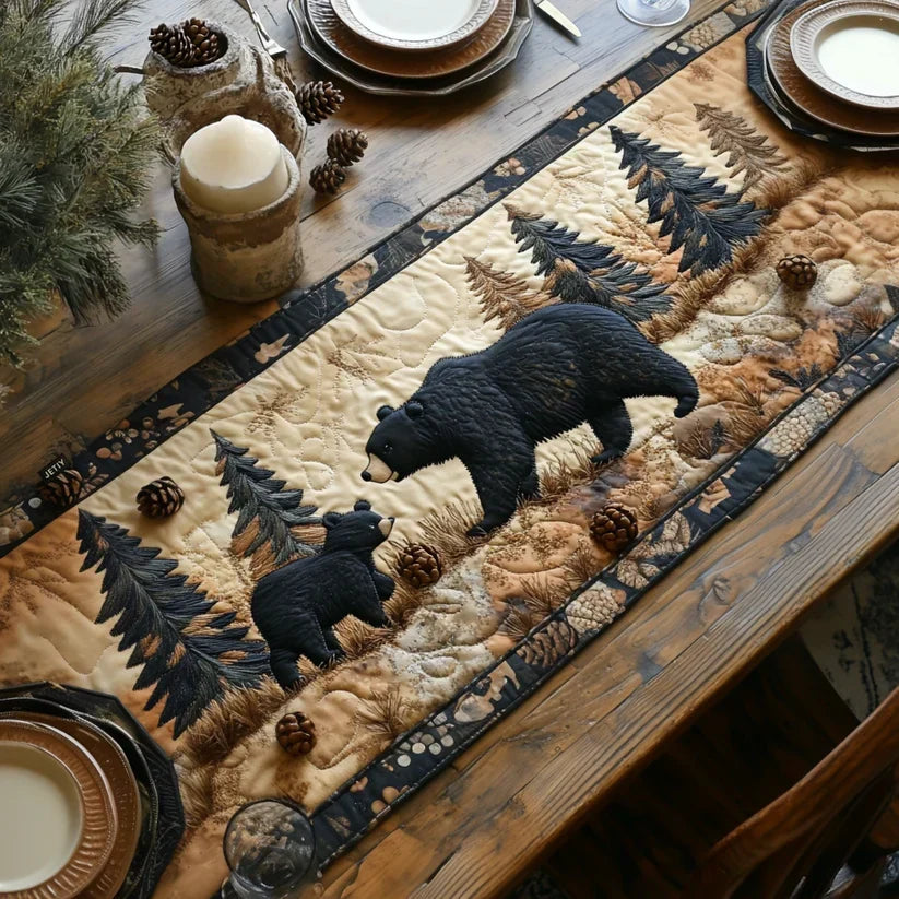 Quilted table runner with a Black Bear Family design of a mother bear and two cubs walking among tall pines, with mountains and still water behind