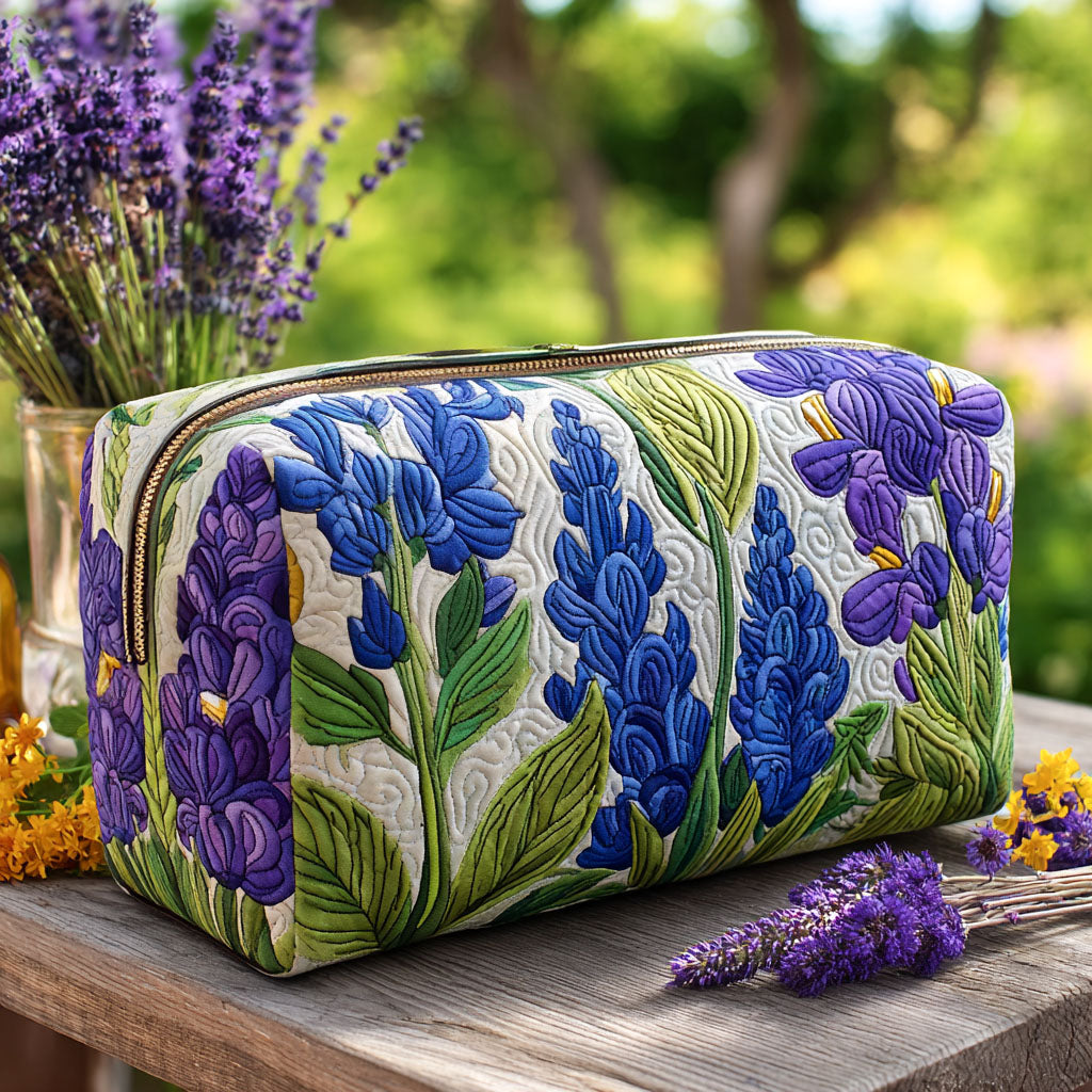 Quilted make-up bag with the Bloom of Light design of white daisies and small sunflowers scattered over a bright ground with fine green leaves
