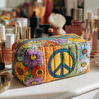 Blooming Peace quilted make-up bag with blue peace sign framed by sunflowers and wildflowers on patchwork
