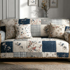 Blue Meadow quilted sofa cover with navy and cream squares of small ditsy florals, fine checks and narrow stripes