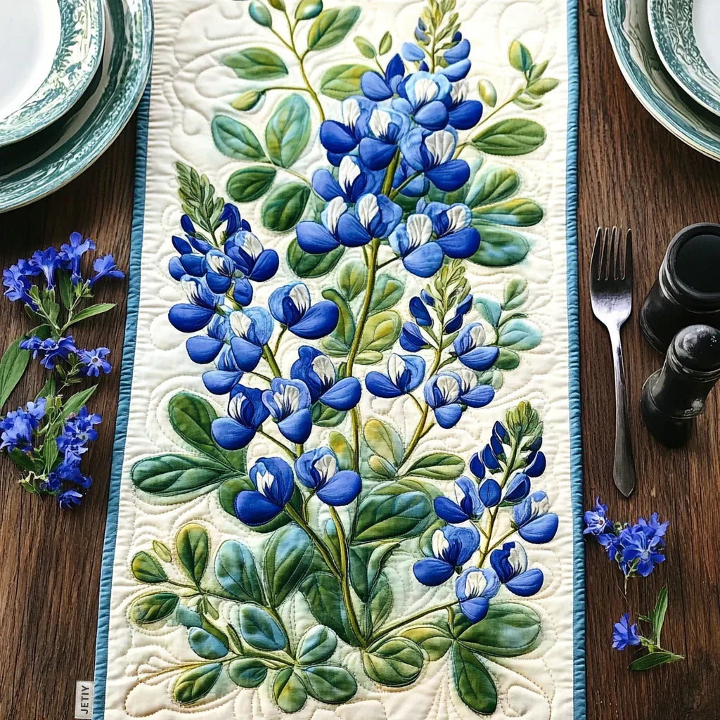 Quilted table runner with tall lupin spires in blue, violet and pink above green leaves