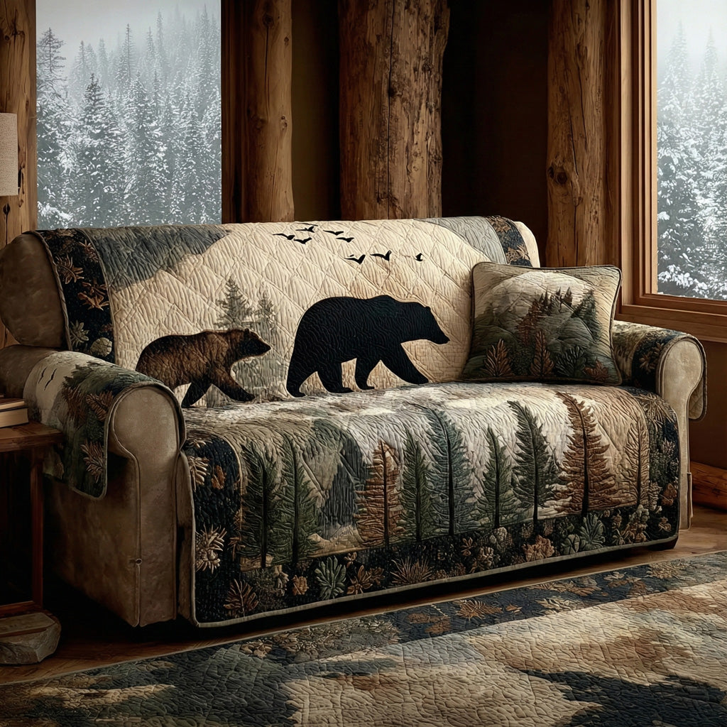 Cabin Bear Patrol quilted sofa cover with a black bear and cub crossing a misty forest panel with geese above and a pine border
