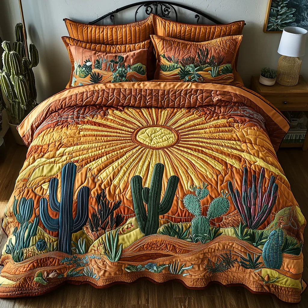 Quilted bedspread set with tall saguaro cacti against an early gold and apricot sky, the Cactus Sunrise design