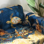 Golden Sea Turtles quilted sofa cover – golden turtles on deep blue waves