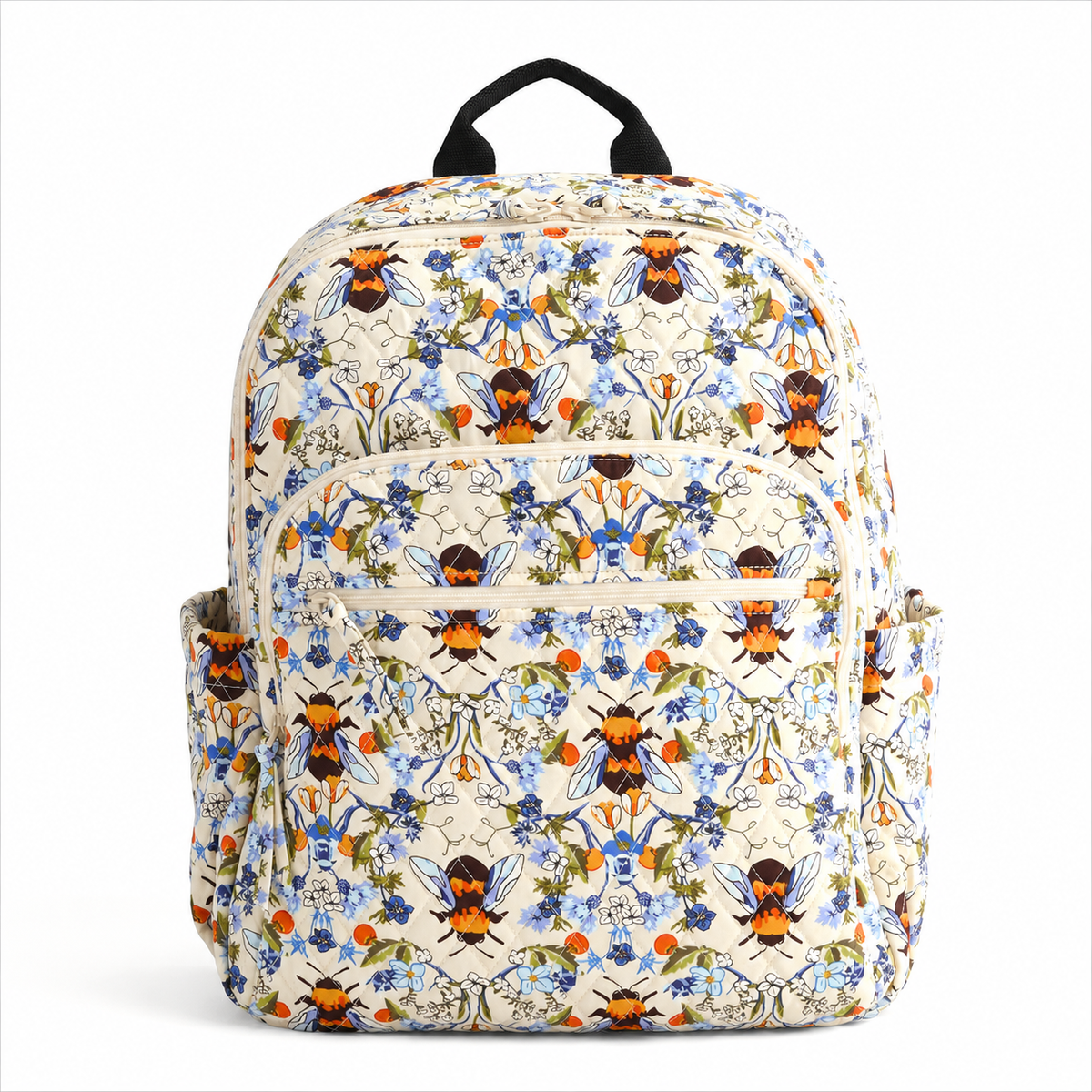 Artisan quilted backpack with bees moving amongst open flowers and leaves in gold and soft petal tones