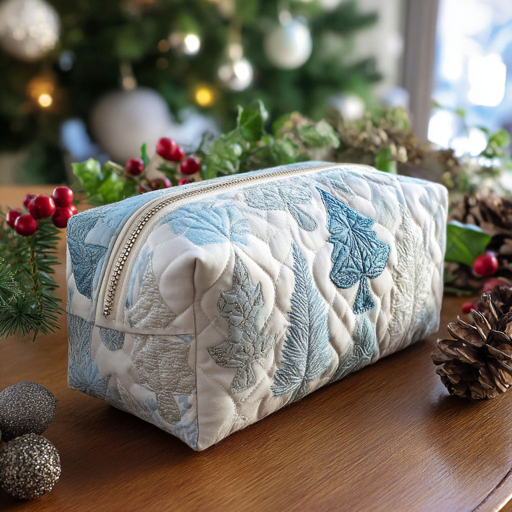 Cheerful Eve quilted make-up bag with winter white quilting with pale blue Christmas trees and snowflakes