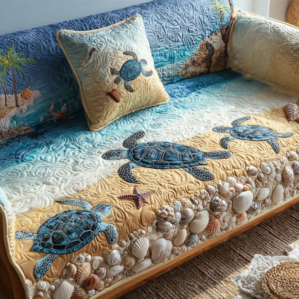 Coastal Charm quilted sofa cover with sea turtles gliding from deep blue water onto golden sand with a border of shells