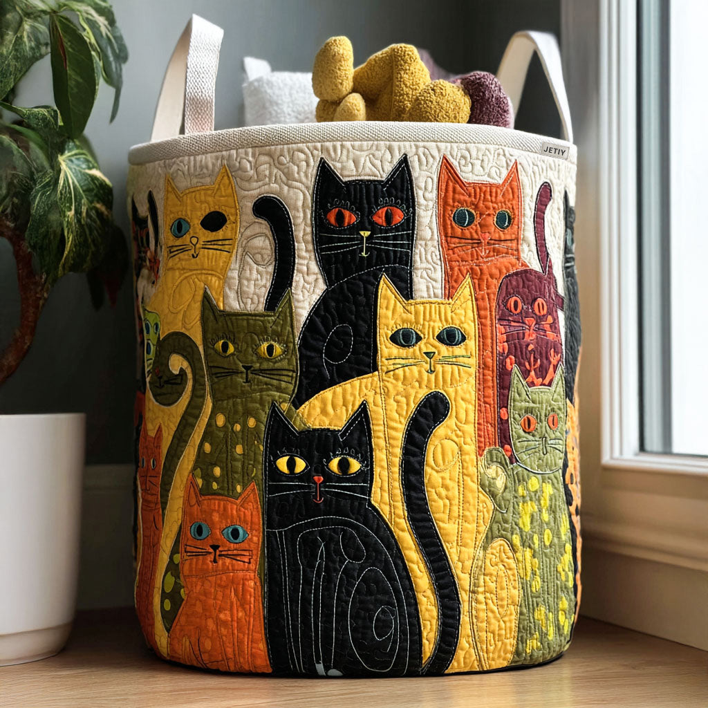 Quilted laundry basket with a Cat Carnival design of many different cats in stripes, spots and patches tumbling across the fabric, with wave stitching and carry handles
