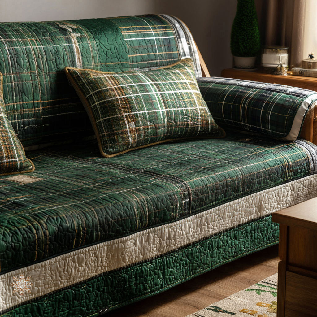 Highland Tartan quilted sofa cover in deep forest-green tartan picked out in cream, gold and black with cream quilted bands