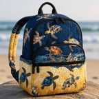 Artisan quilted backpack with a white West Highland terrier amongst broad tropical leaves and bright blooms
