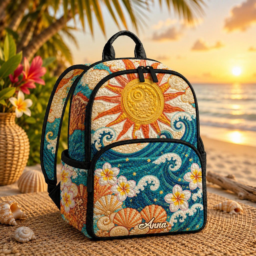 Artisan quilted backpack with tropical blooms and ocean water in warm greens and sea blues