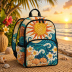 Artisan quilted backpack with tropical blooms and ocean water in warm greens and sea blues