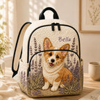 Artisan quilted backpack with a corgi amongst lavender and soft purple florals across the quilted front panel