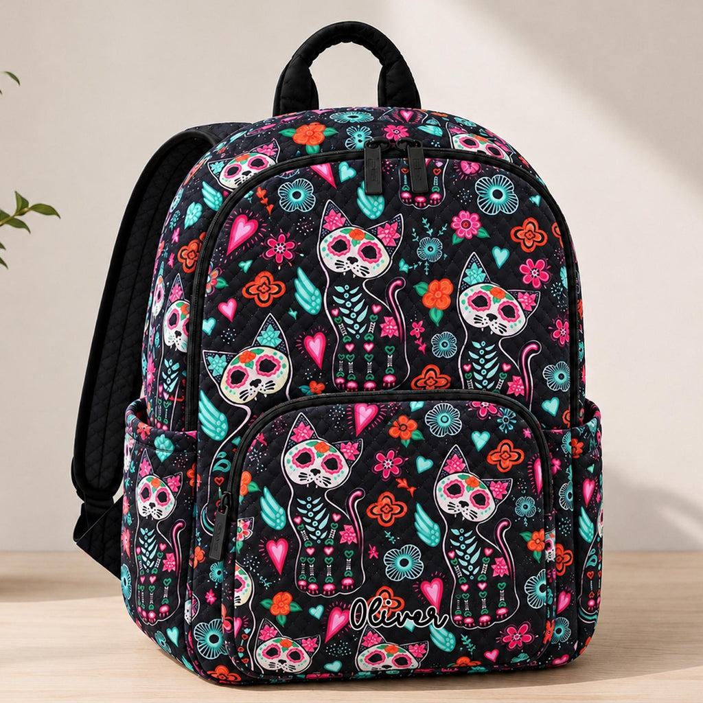 Artisan quilted backpack with a Day of the Dead cat, its face marked out in flowers, swirls and patterns