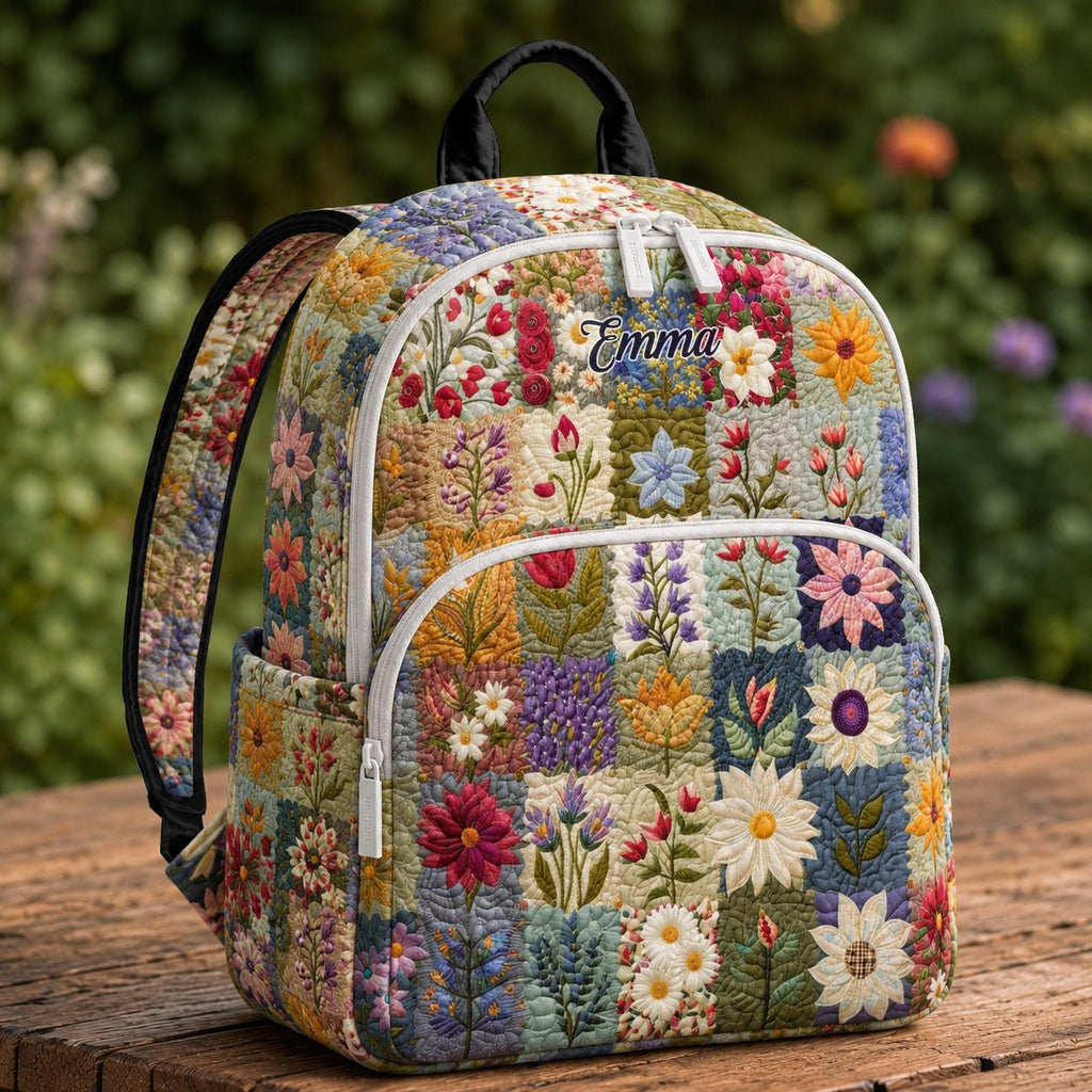 Artisan quilted backpack pieced from squares of flowered cotton in cottage-garden colours