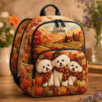 Artisan quilted backpack with puppies amongst pumpkins in warm autumn oranges and browns across the quilted front