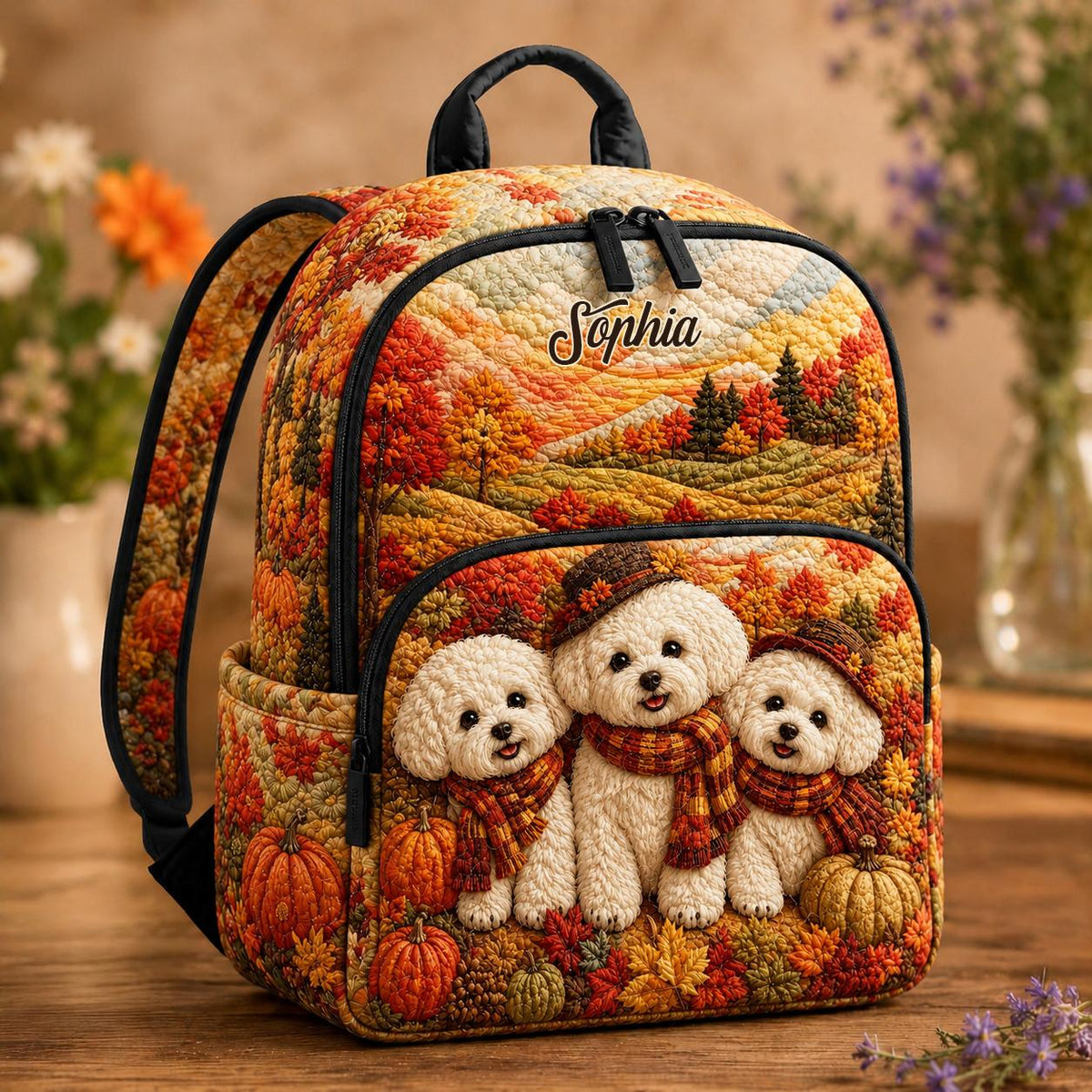 Artisan quilted backpack with puppies amongst pumpkins in warm autumn oranges and browns across the quilted front