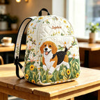 Artisan quilted backpack with a beagle puppy amongst open flowers and leaves, long ears and eyes turned up