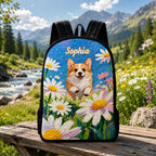 Artisan quilted backpack with a corgi sitting ears up amongst open flowers and green leaves