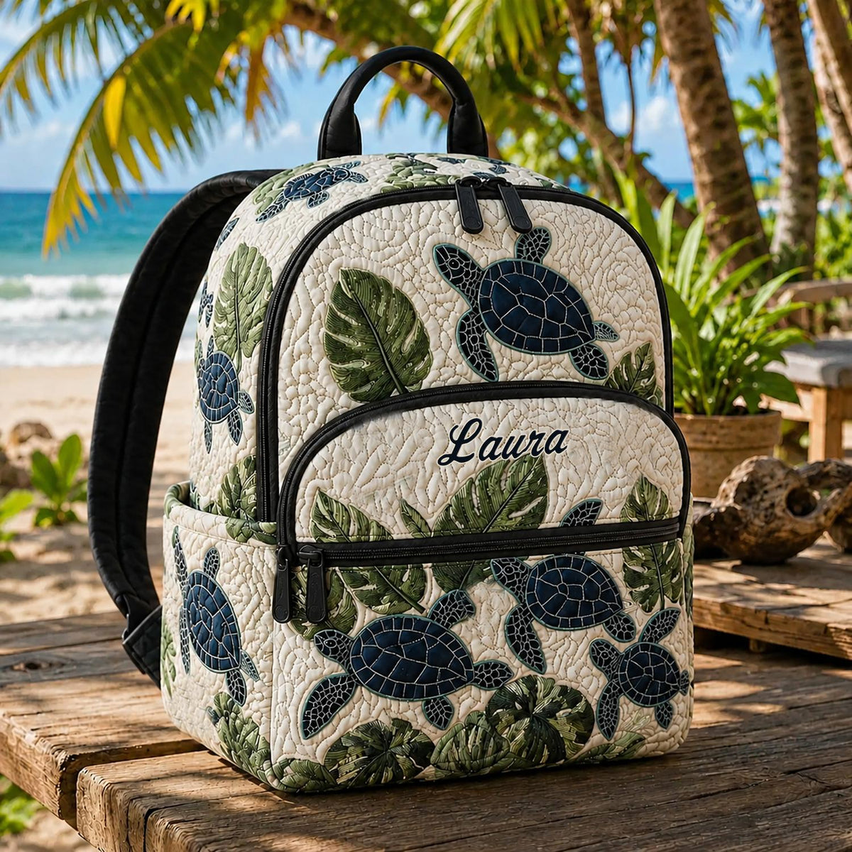 Artisan quilted backpack with sea turtles swimming through deep blue water