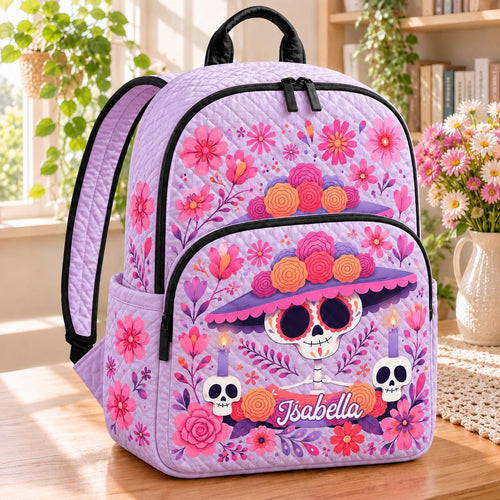 Artisan quilted backpack with a sugar skull tucked into a posy of softly drawn flowers and small patterns