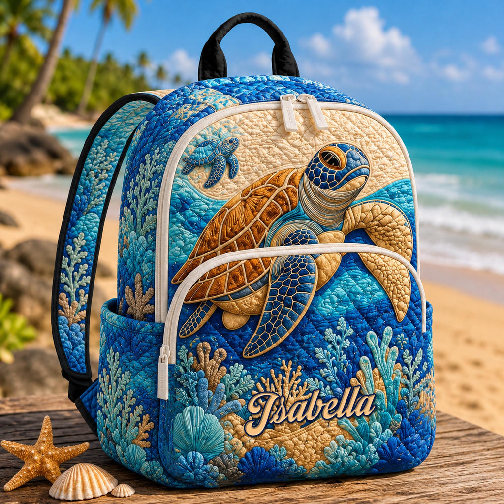 Artisan quilted backpack with a turtle swimming over a coral reef in blues and greens across the front