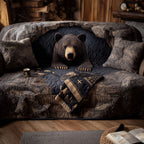 Midnight Bear quilted sofa cover – black bear among dark rocks