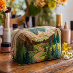 Quilted make-up bag with an Emerald Canopy design showing a vintage camper van beneath a canopy of green leaves with retro daisies