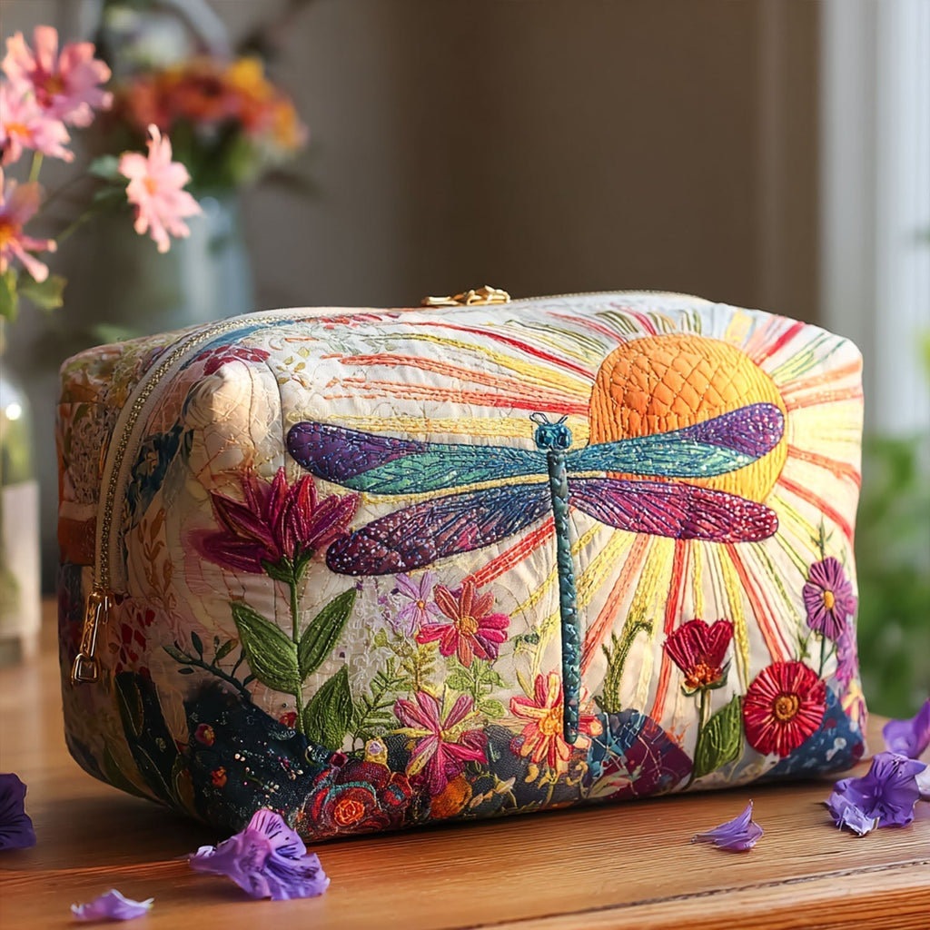 Quilted make-up bag with a Flight of Grace design of Scandinavian folk-art dragonflies drifting above wildflowers