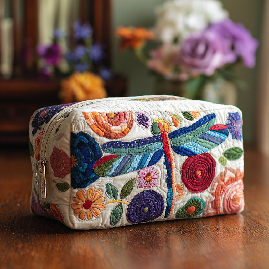 Quilted make-up bag with a Flip Flap Fly design of folk-art dragonflies darting between blue and gold blooms