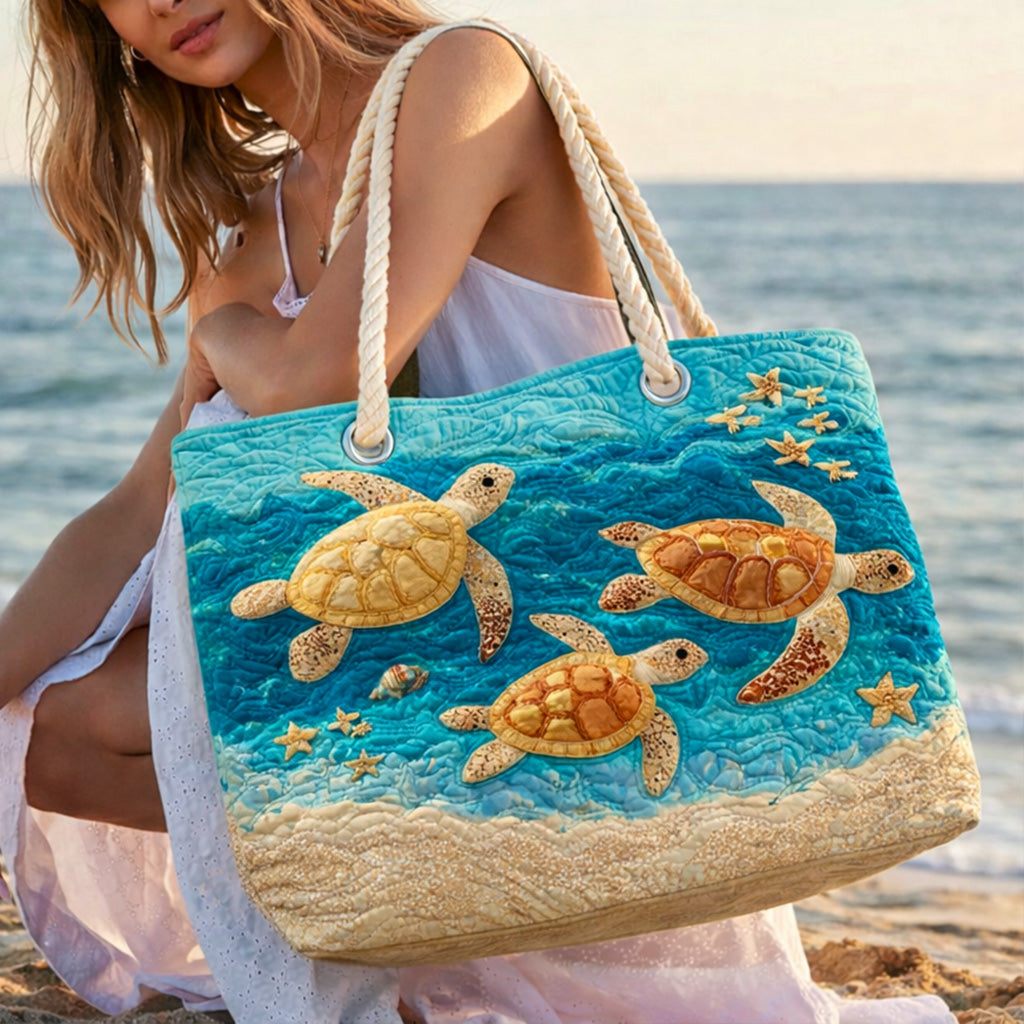 Quilted beach bag with the Golden Turtle Coast design, sea turtles in gold-lit water against deep blue