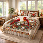 The Cardinals quilted bedspread set laid out on a made bed