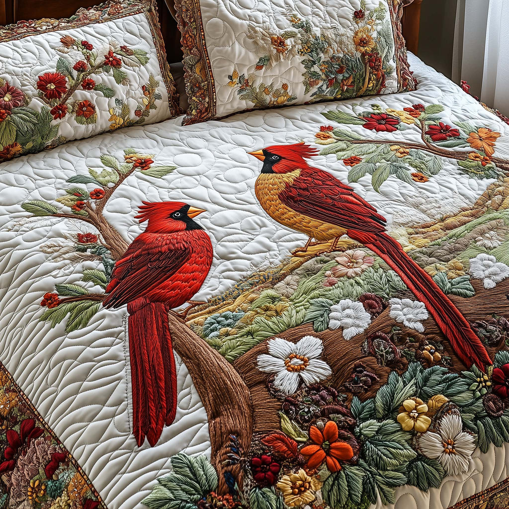 Quilted bedspread set with two red cardinals among snowy branches and bright berries in the Cardinals design
