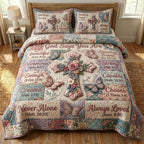 Quilted bedspread set with open pages and lines of scripture among roses and peonies, the Scripture and Flowers design